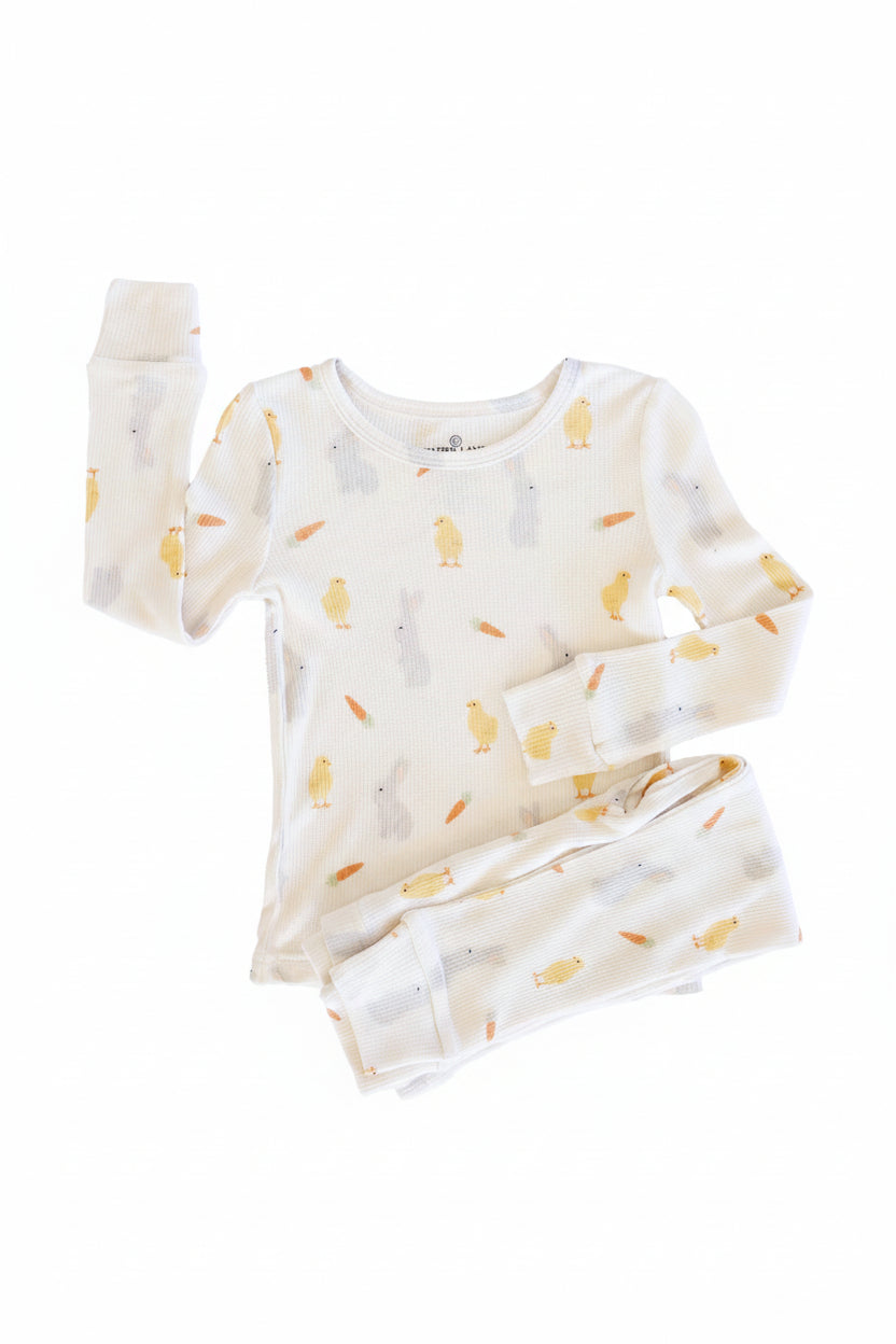 kids long sleeve and pants two piece pajama set for kids with chicks, carrots and bunnies on a white background 