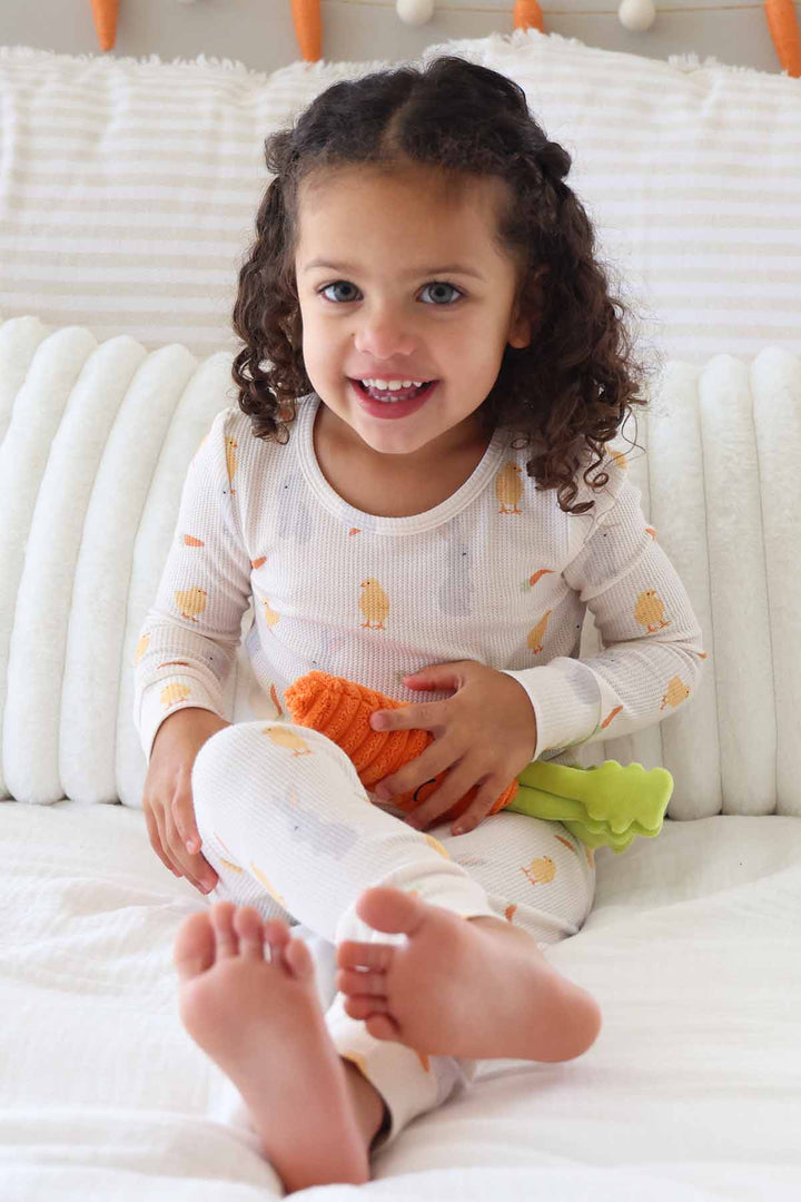 sweet peep easter two piece pajama set for kids with a stuffed carrot 