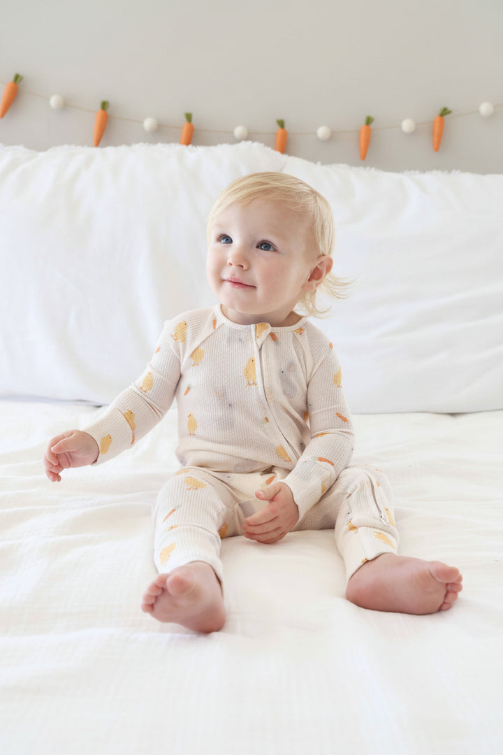 baby boy wearing the sweet peep bamboo waffle convertible zip romper for babies and toddlers 