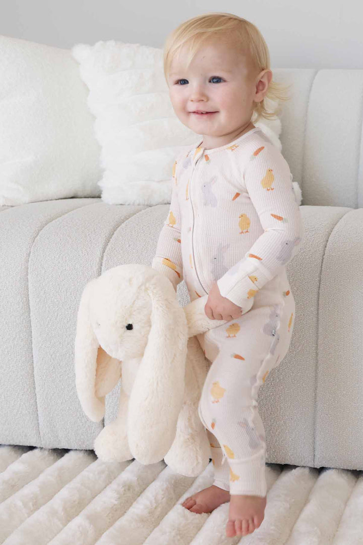 gender neutral easter convertible zip romper pajama for babies and toddlers long sleeve with flip mitts and footies 