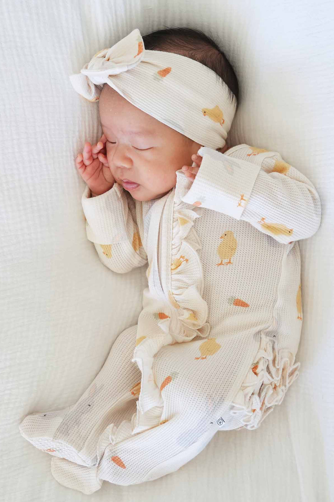 sweet peep bamboo waffle ruffle zipper footie with ruffles on the bottom and along the zipper 