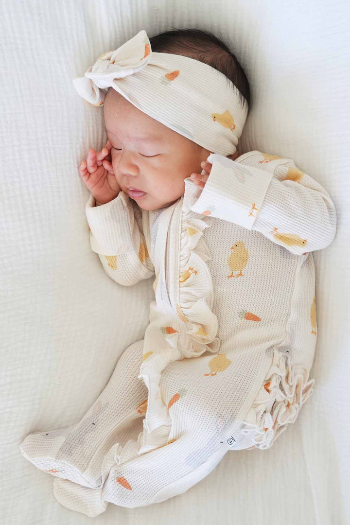 sweet peep bamboo waffle ruffle zipper footie with ruffles on the bottom and along the zipper 