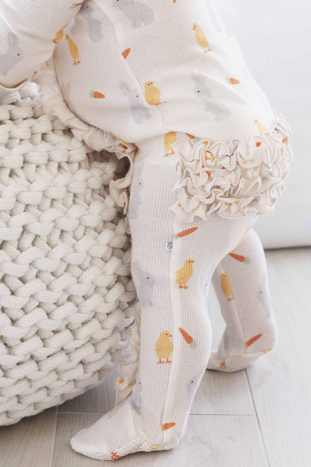 neutral easter bamboo waffle ruffle zipper footie with chicks, carrots and bunnies 