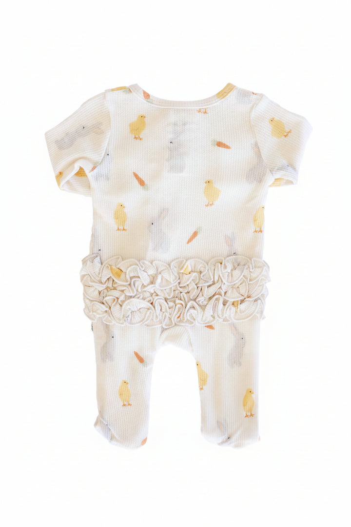 back view of ruffle bottom zipper footie for girls in sweet peep bamboo waffle fabric 