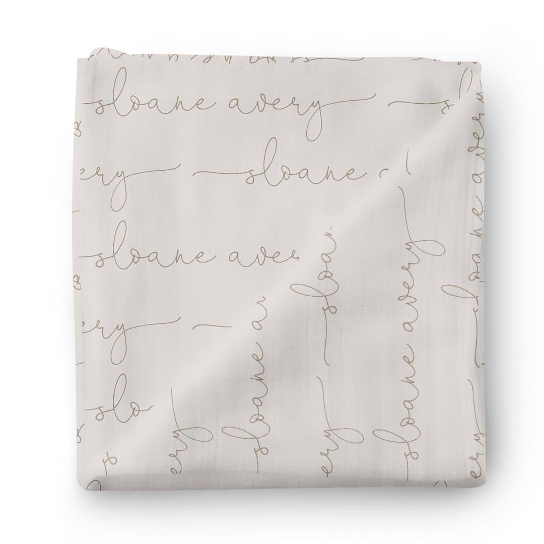 taupe script baby name swaddle blanket 