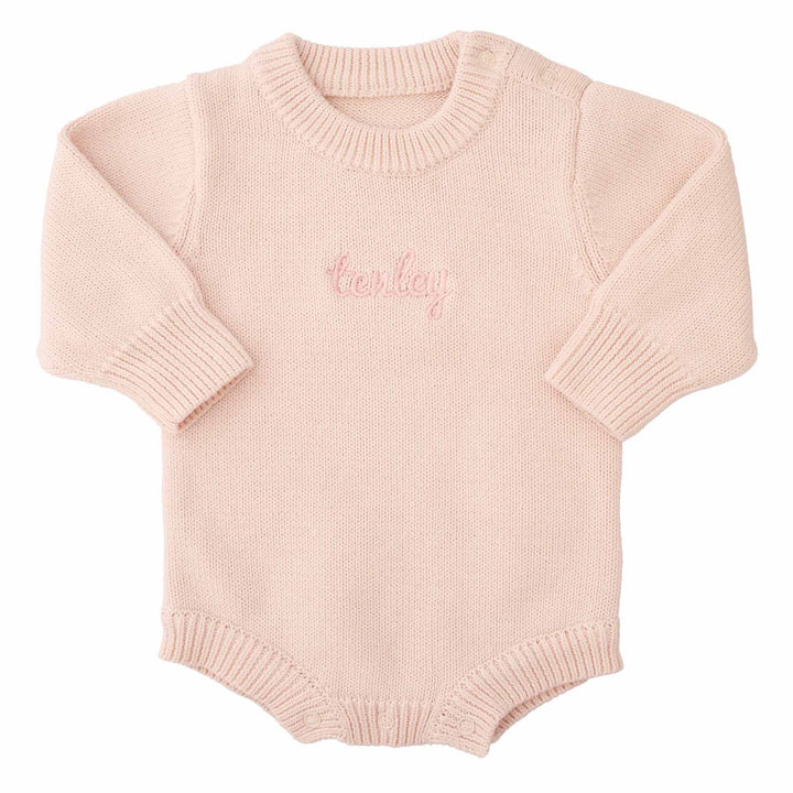 light pink embroidered long sleeve knit sweater romper for babies with pink thread and script font 