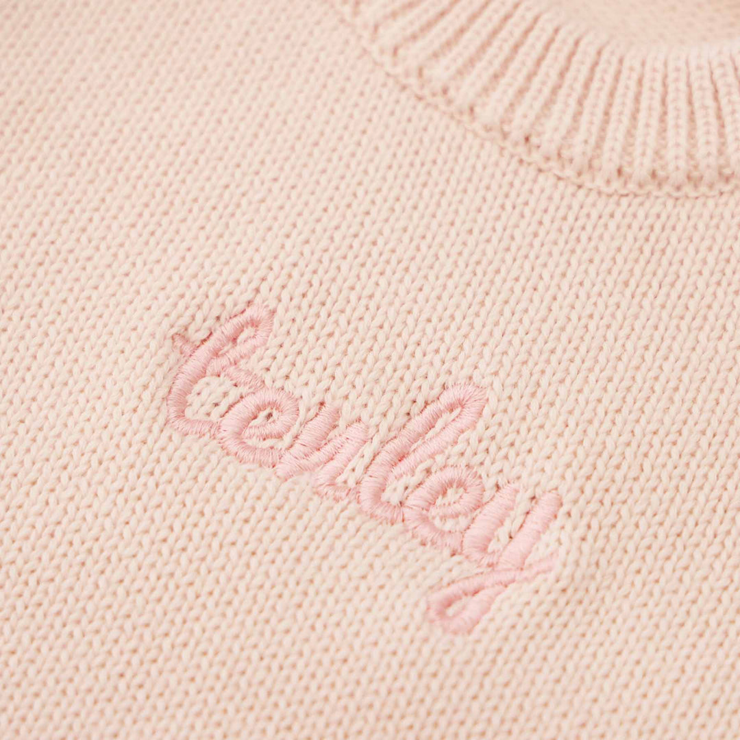 tea rose long sleeve knit sweater romper with light pink thread in script font 