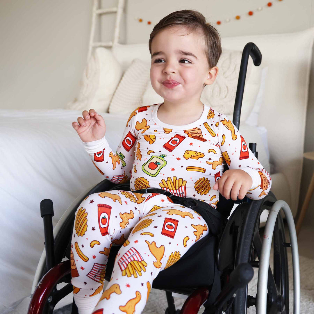 boy wearing a food themed two piece pajama set 