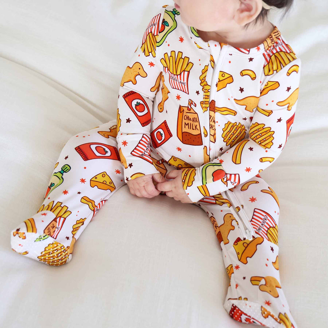 white, yellow, red and green bamboo viscose baby zipper footie pajama with food on it