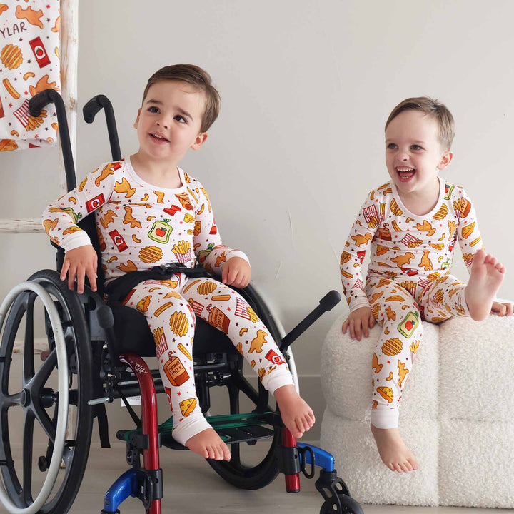 two boys wearing matching food pajama sets