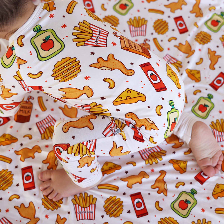 close up of tiny bites black friday exclusive print on a convertible zip romper 