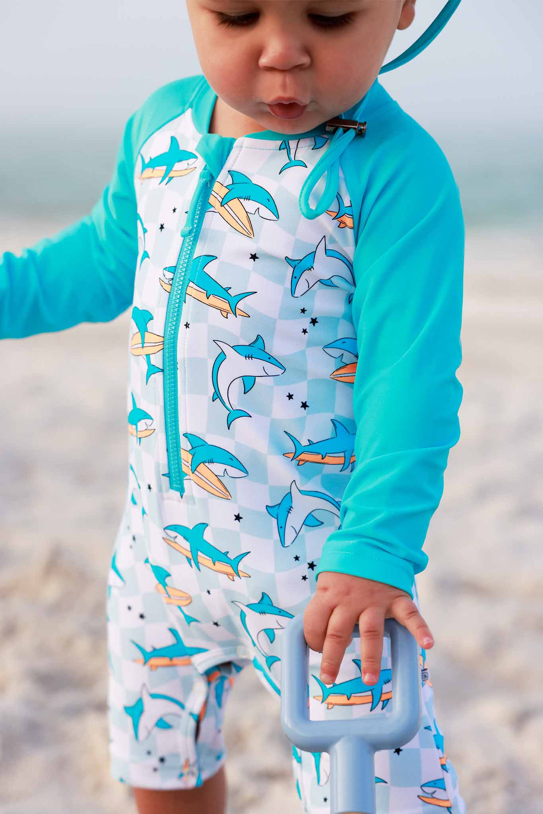 closeup of totally jawsome swim romper shortie for boys 