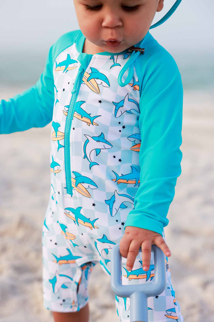 closeup of totally jawsome swim romper shortie for boys 