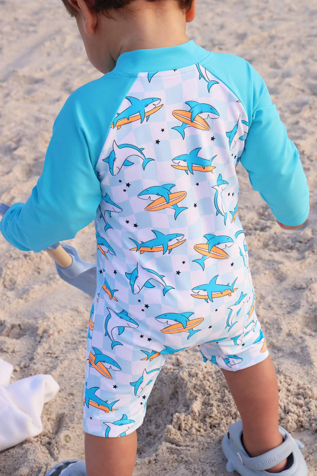 back view of retro surfing shark swim romper shortie for babies 