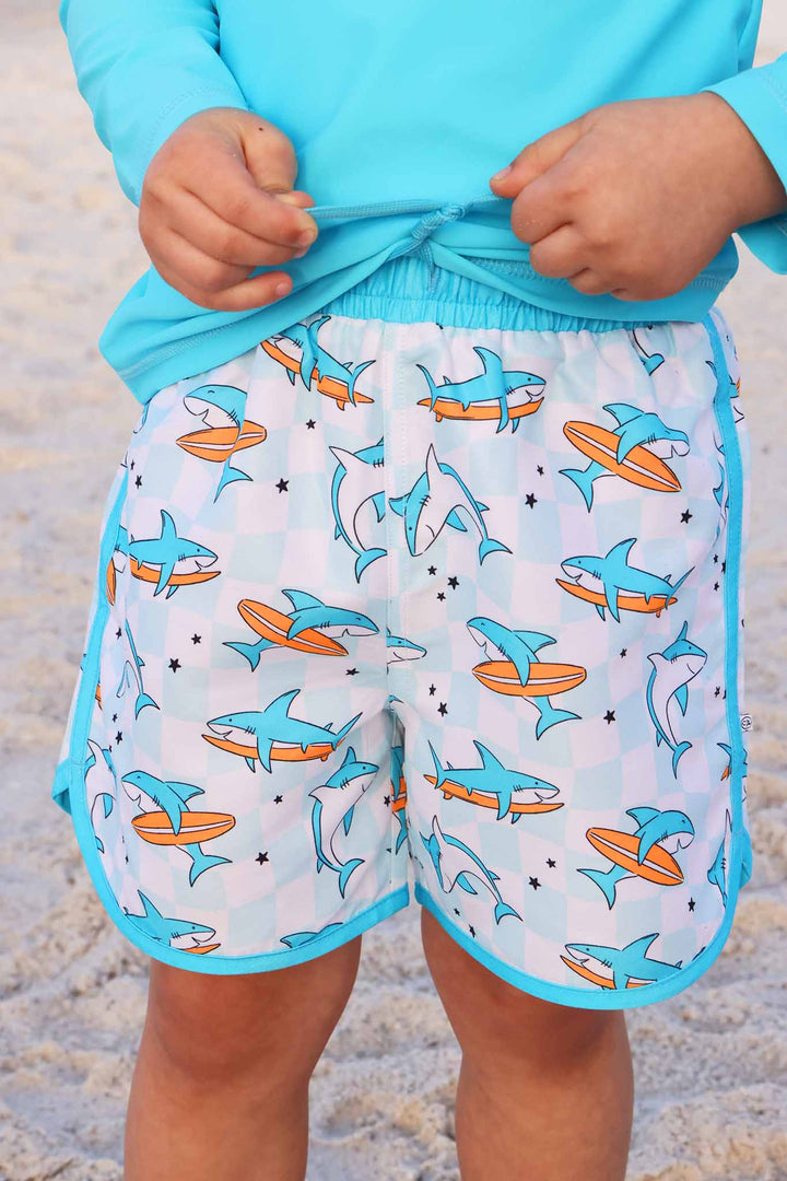 closeup of totally jawsome boy's swim trunks 