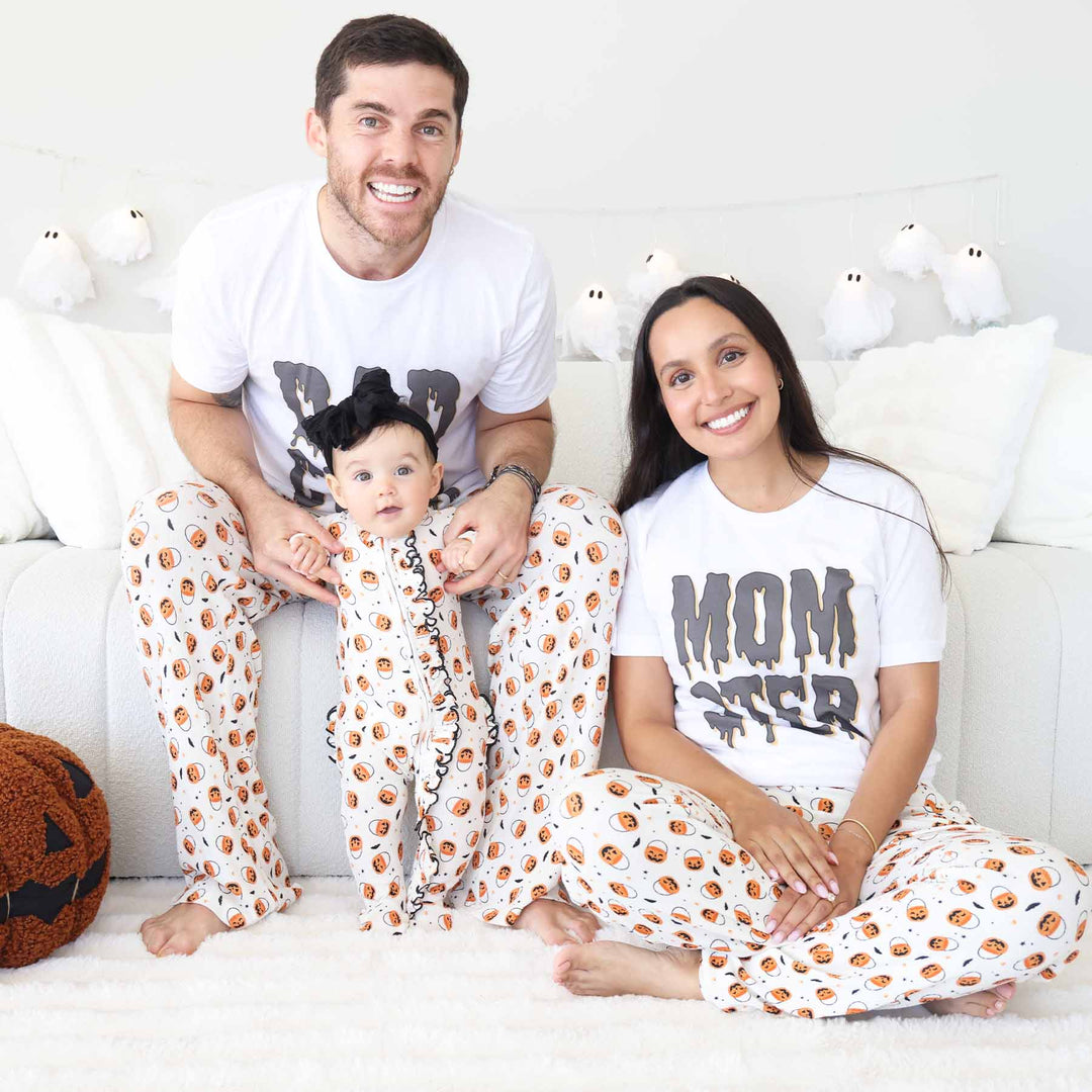 neutral pajama pants with jack o lantern trick or treat bags 