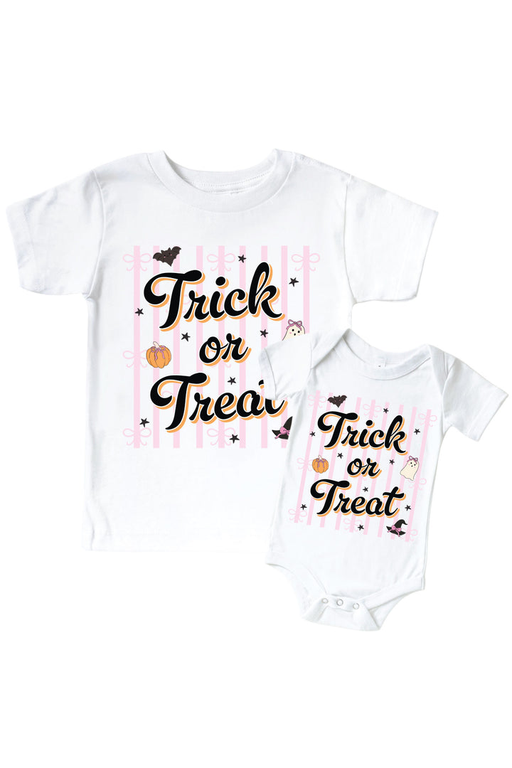 Matching white kids' t-shirt and baby bodysuit, both printed with 'Trick or Treat' text on pink stripes with pumpkin and bat accents.
