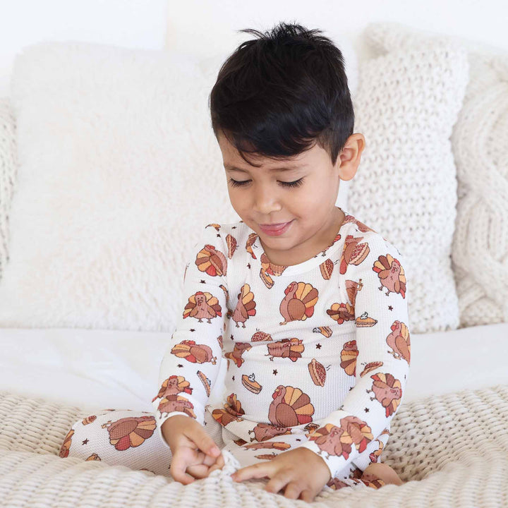 cream bamboo waffle two piece pajama set with fall toned turkeys and pumpkin pie 