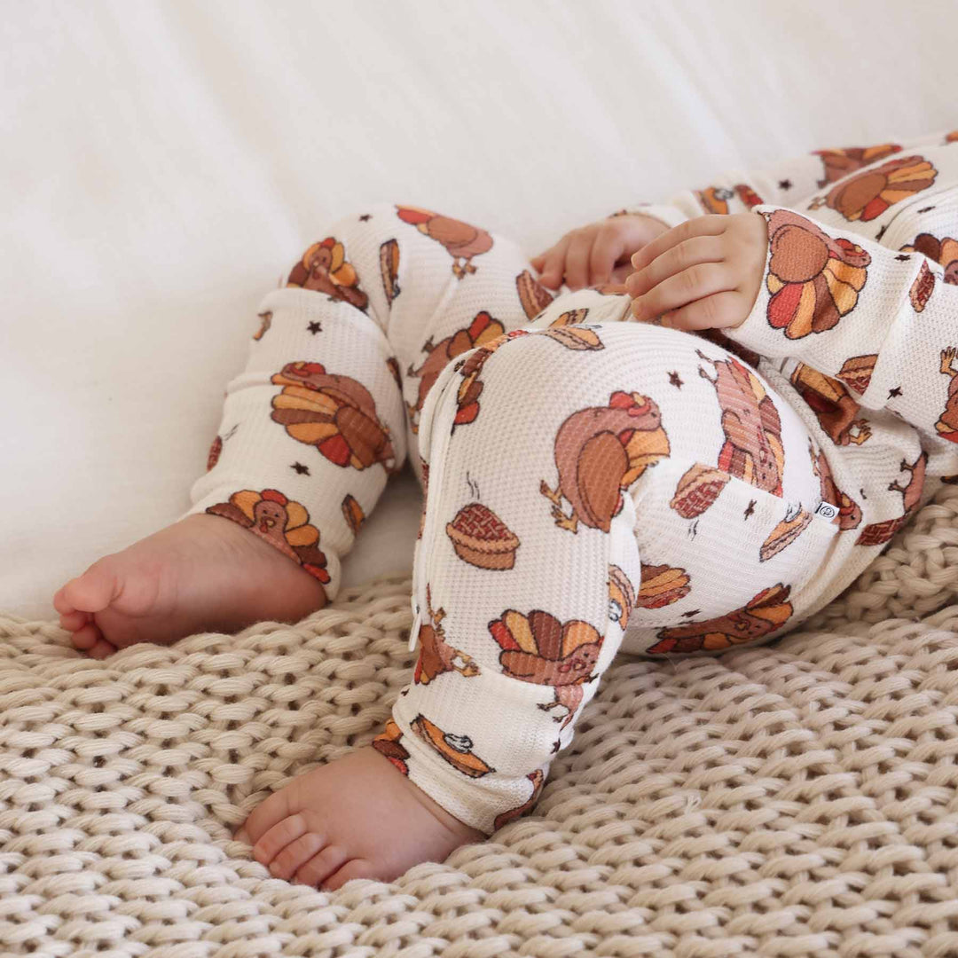 thanksgiving pajama romper with flip mitts and footies on hands and feet 