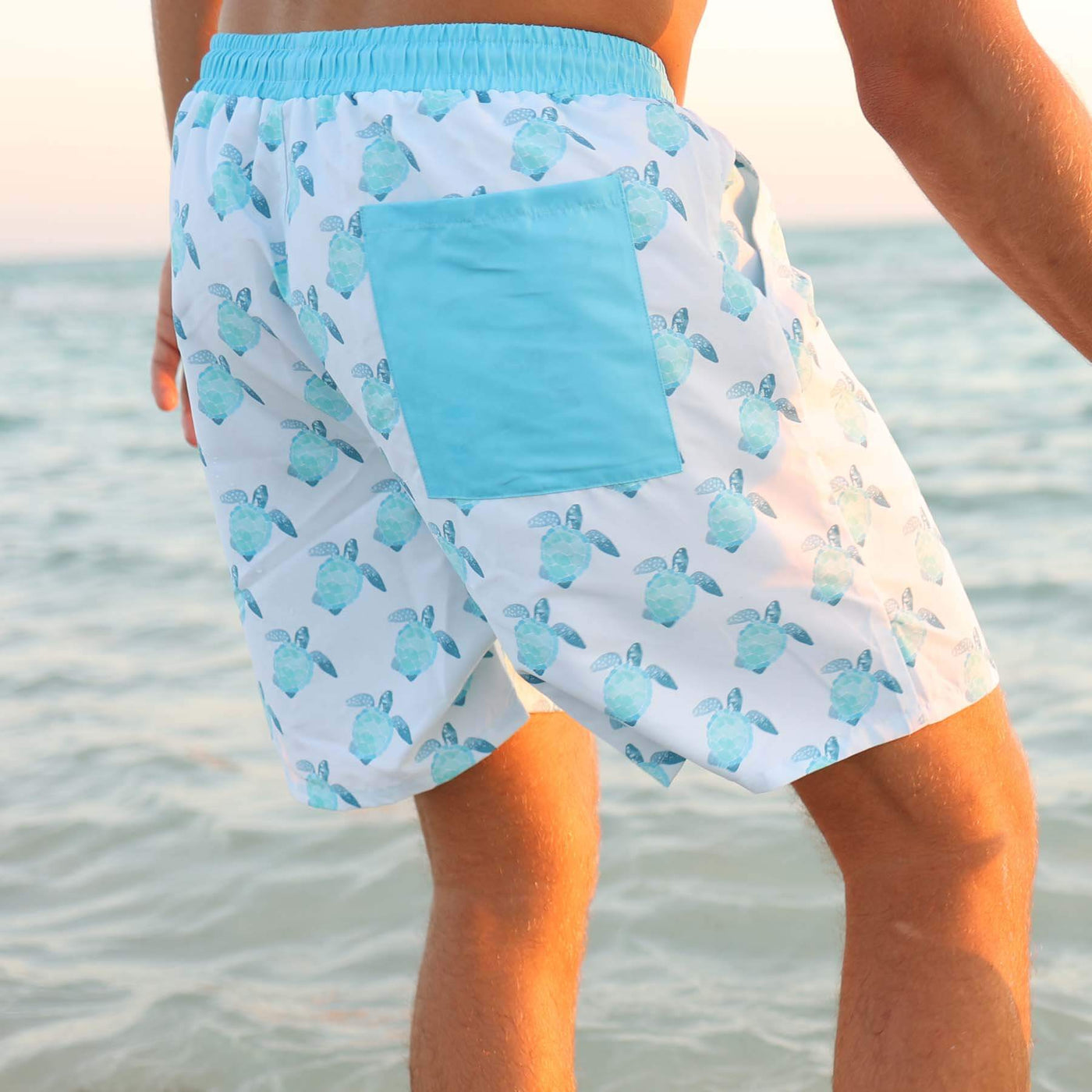 men's swim trunks with tropical turtles blue