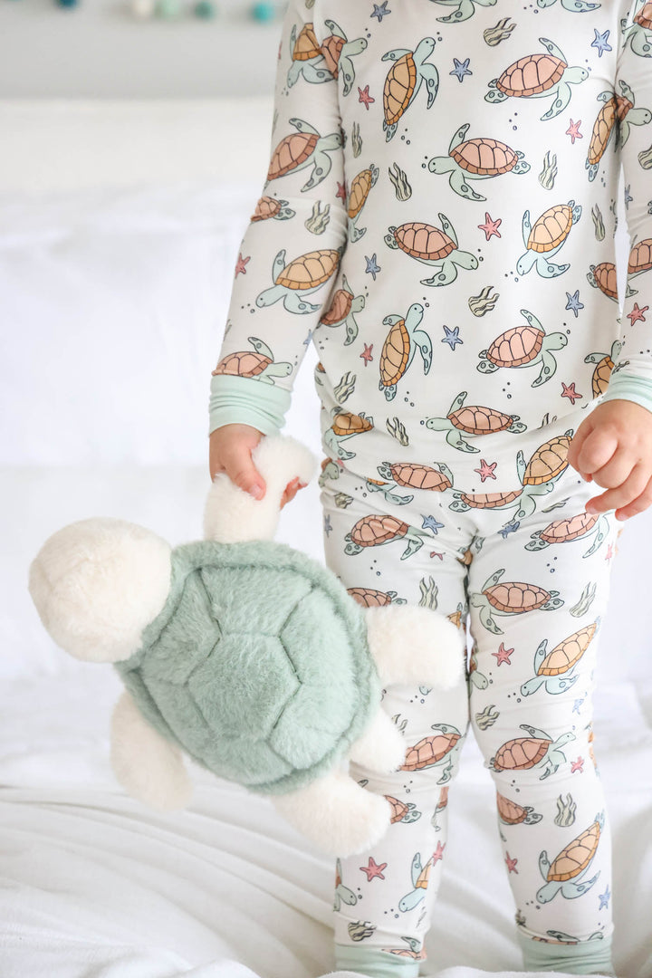 close-up of turtley rad turtle print on bamboo fabric – playful gender neutral design
