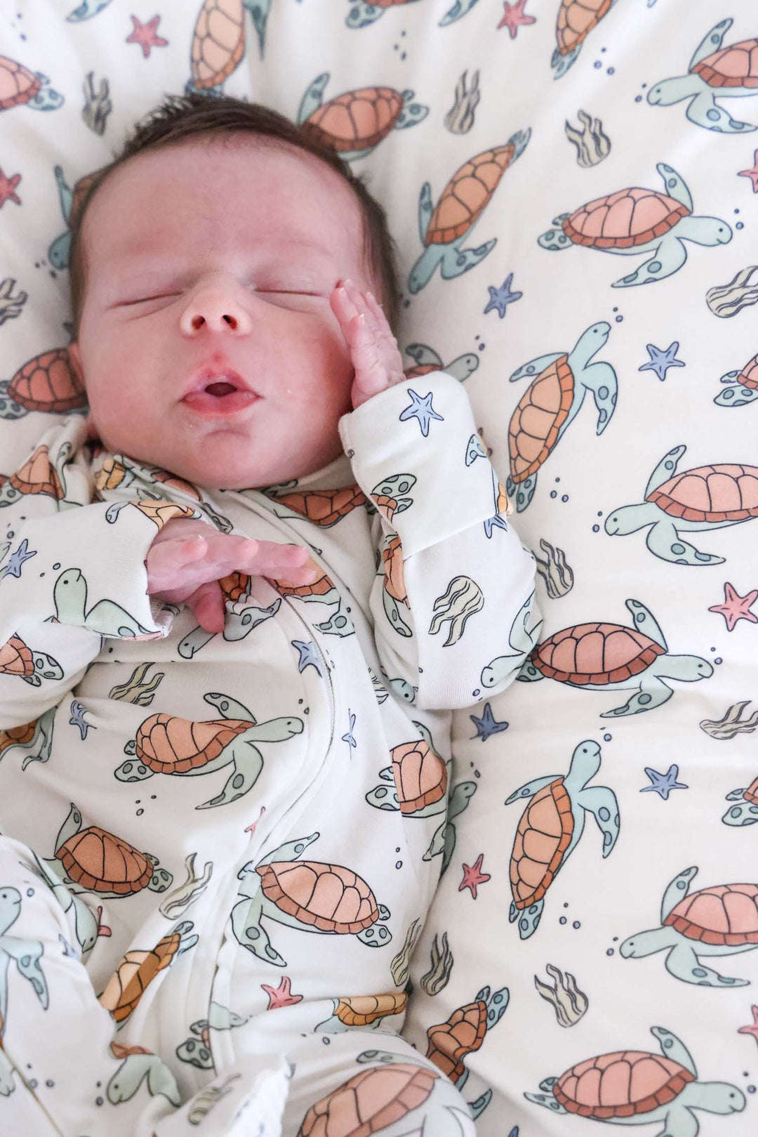 close-up of turtley rad turtle print on bamboo fabric – playful gender neutral design