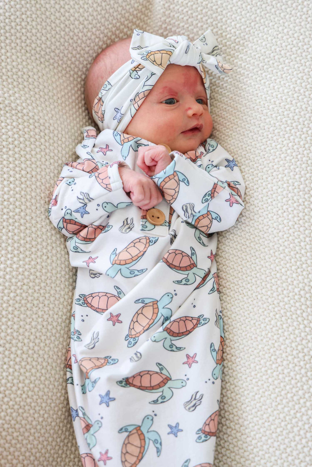 close-up of turtley rad turtle print on bamboo fabric – playful gender neutral design