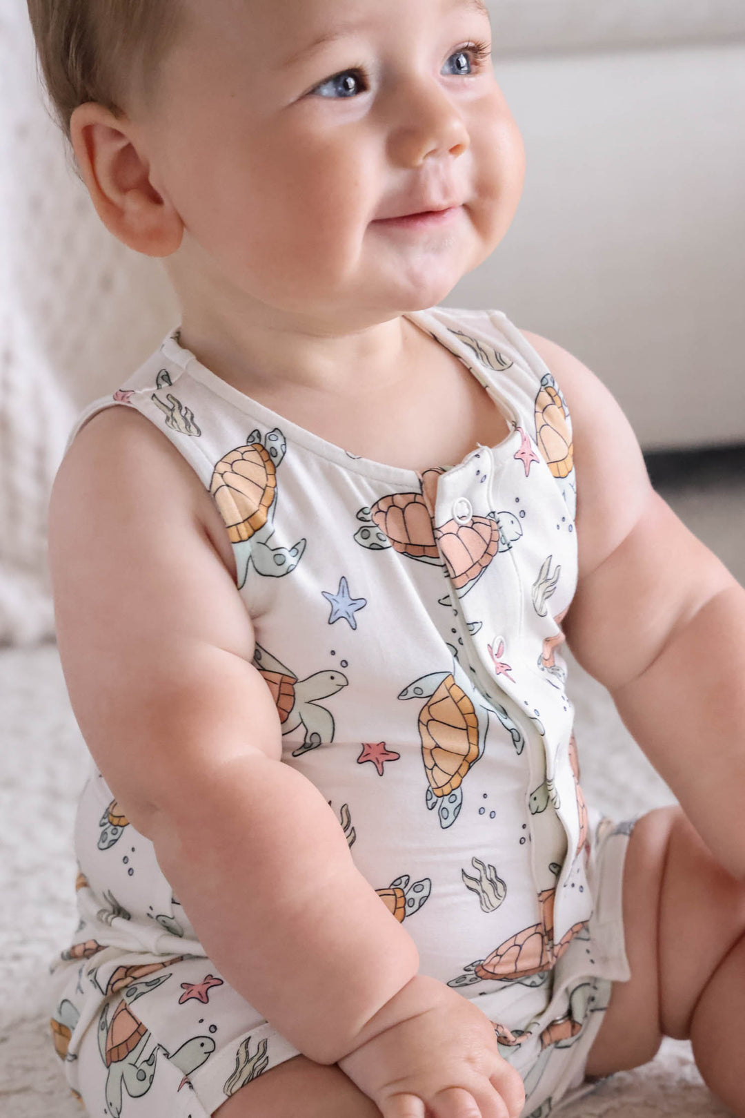 close-up of turtley rad turtle print on bamboo fabric – playful gender neutral design