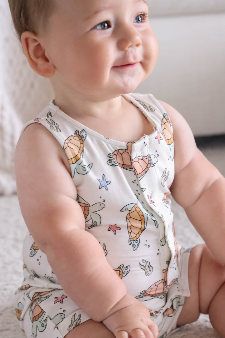 close-up of turtley rad turtle print on bamboo fabric – playful gender neutral design