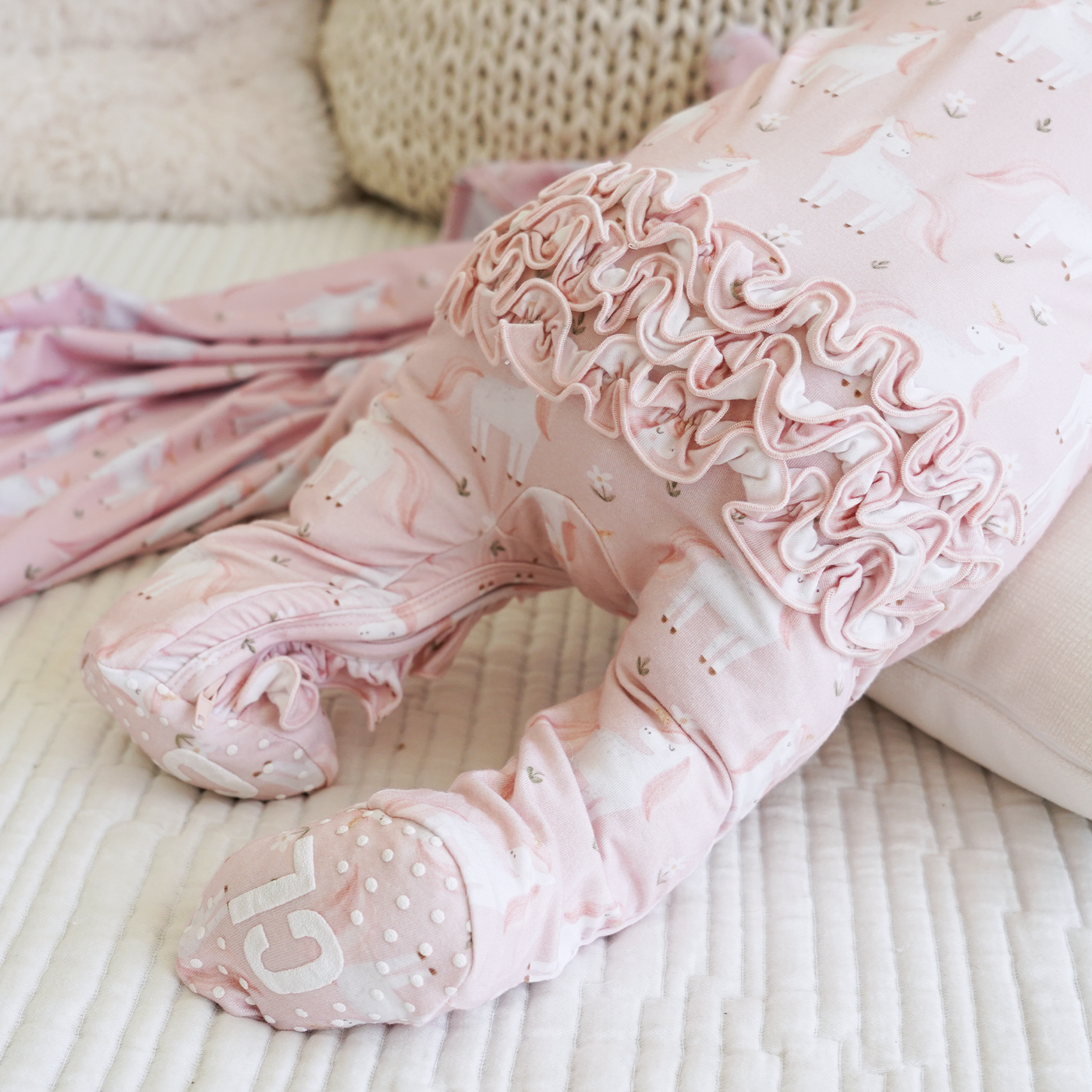 pink unicorn and daisy zipper ruffle footie for babies 