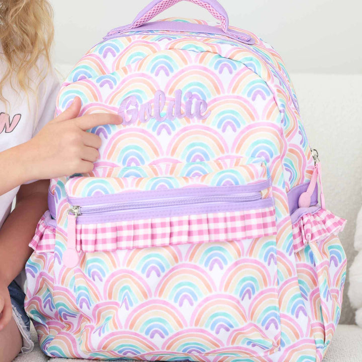 colorful rainbow and pink gingham embroidered backpack for girls with purple name 