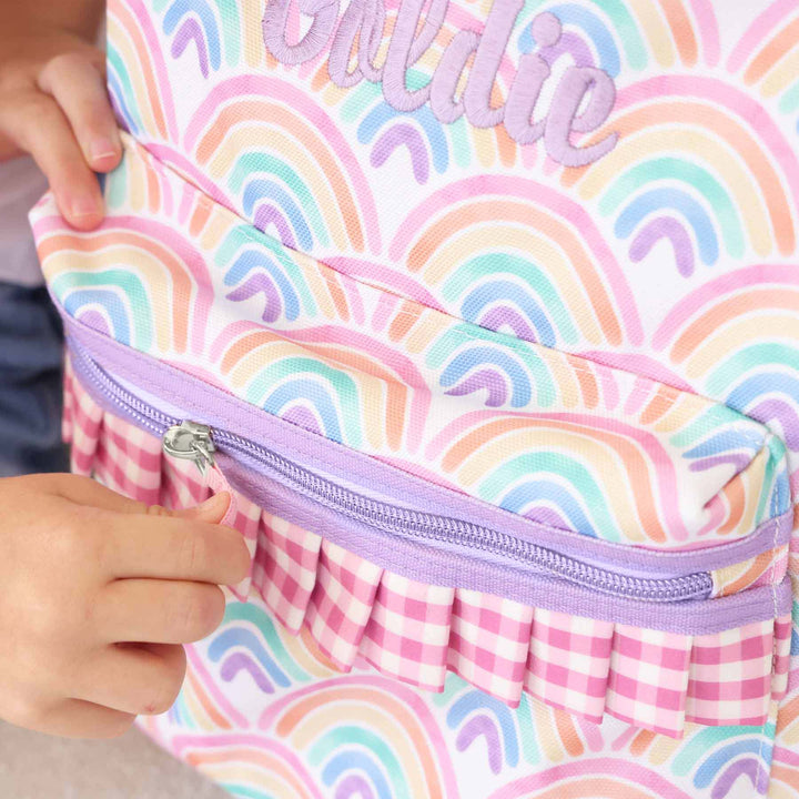 embroidered girls backpack with purple thread and pastel rainbows 