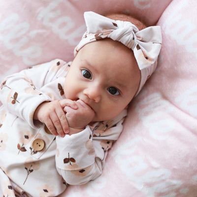 newborn knot gown with muted floral