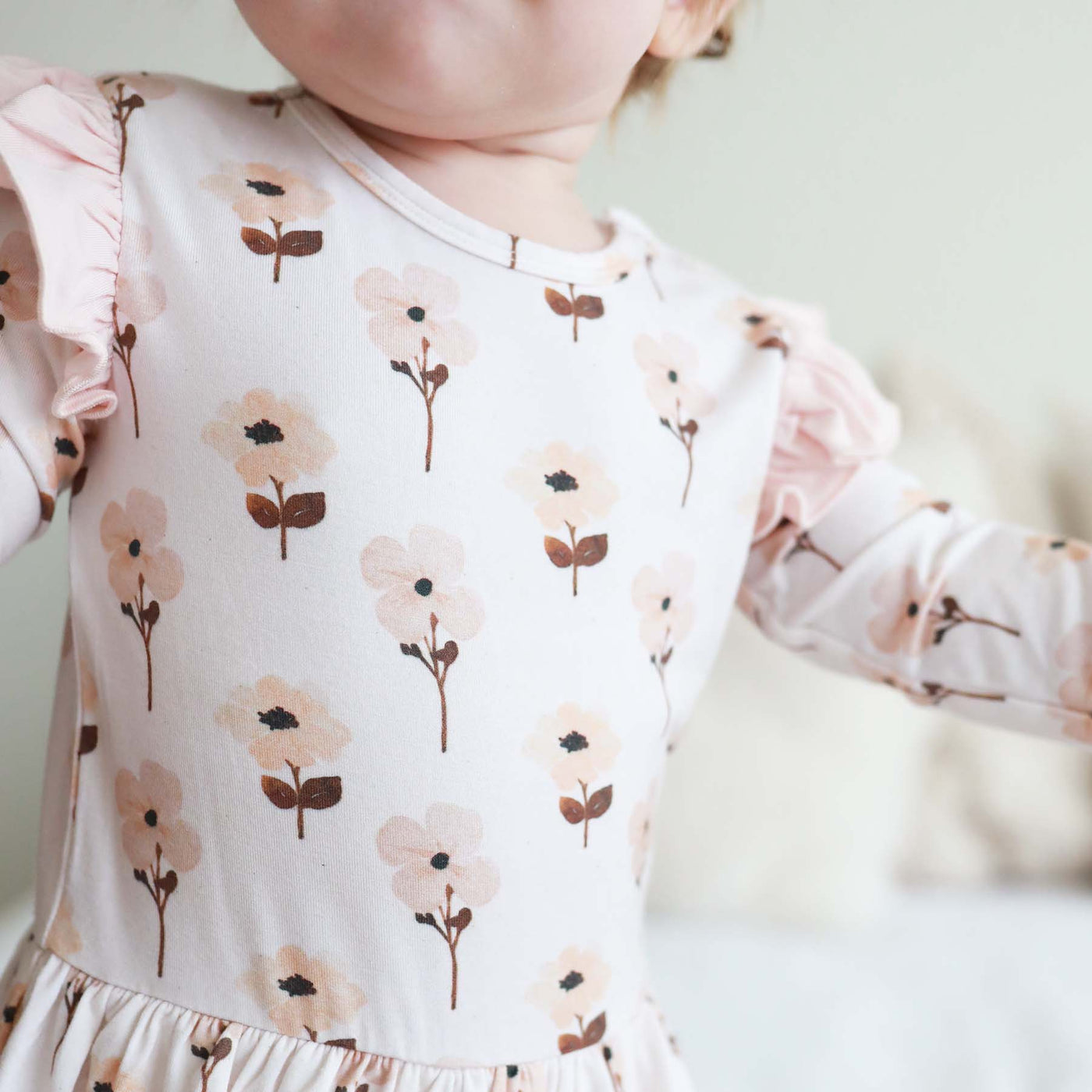 floral bodysuit for babies with ruffle 