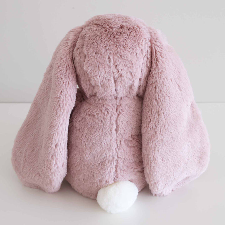 violet bunny stuffed animal with white fluffy tail