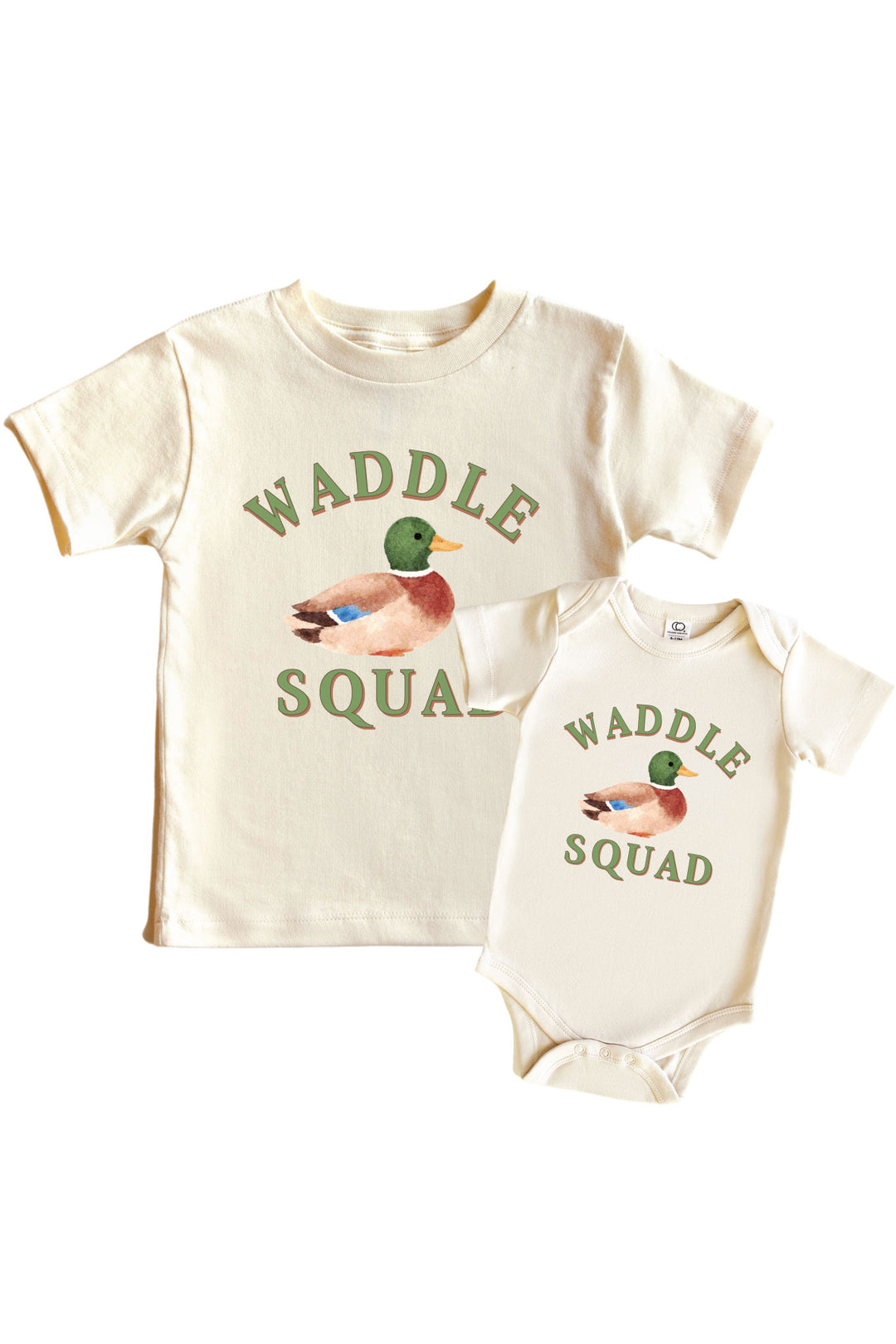 Natural Waddle Squad graphic kids tee and baby bodysuit displayed together, each with WADDLE SQUAD text and mallard duck illustration on front