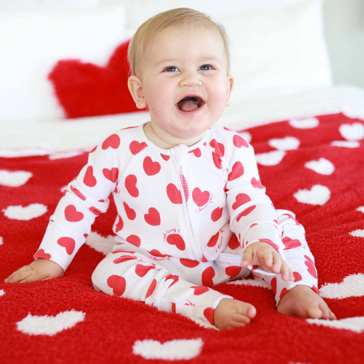 white valentine's day pajama romper for babies with red hearts