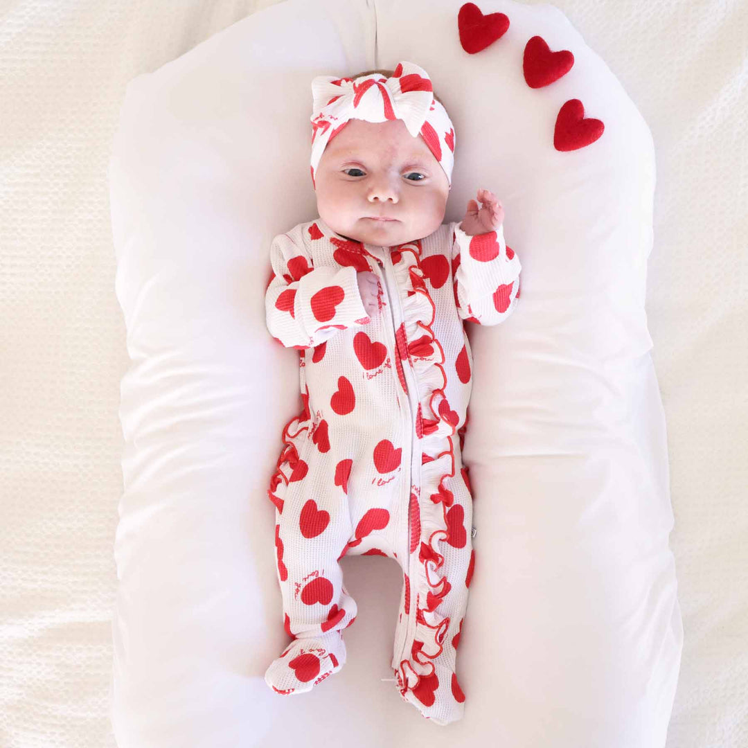 white valentine's day ruffle zipper footie with red hearts