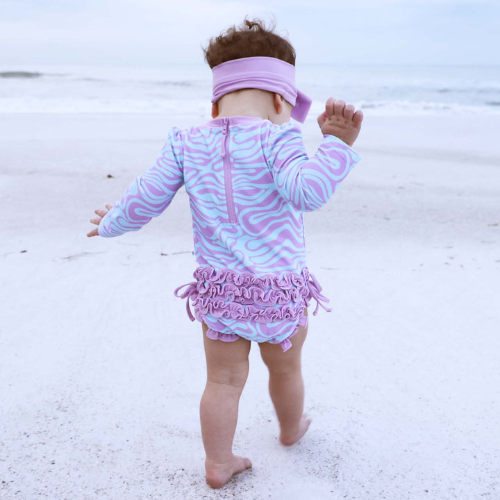 wavy days long sleeve rash guard one piece for babies blue and purple 