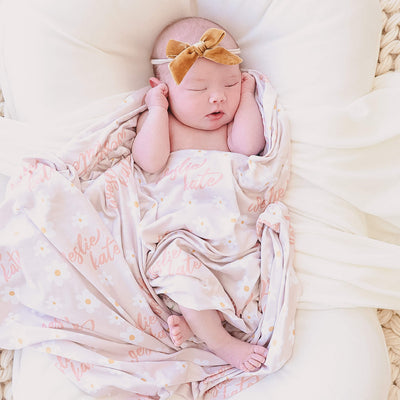 pink and yellow daisy swaddle blanket 