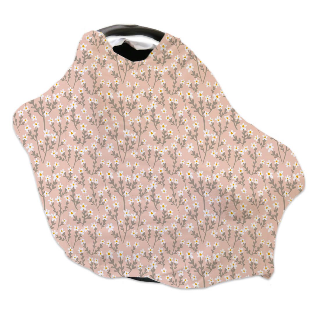 pink multi-use cover for babies with white wildflowers
