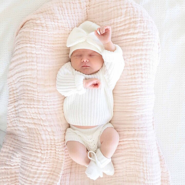 white baby booties with bows