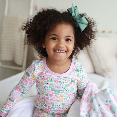 two piece pajama set for toddlers and kids with pink and green flowers 