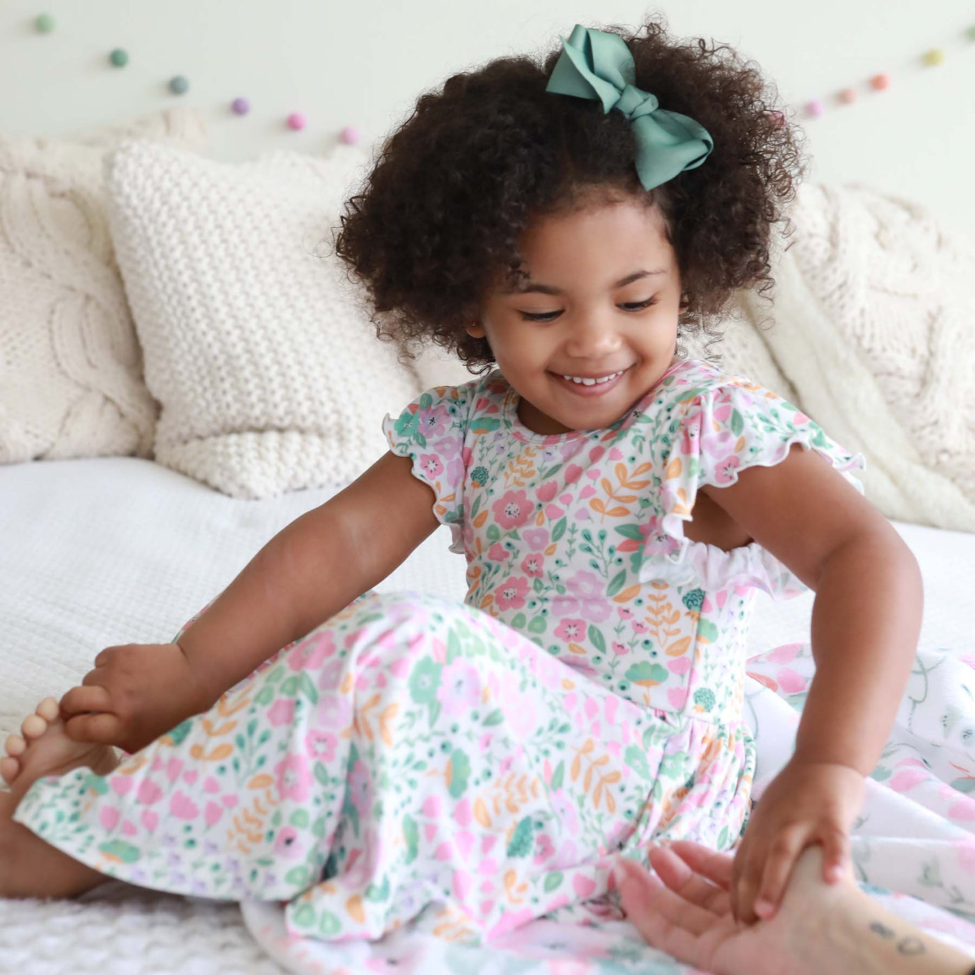 light pink and green floral dress for girls with ruffle sleeves and pockets 