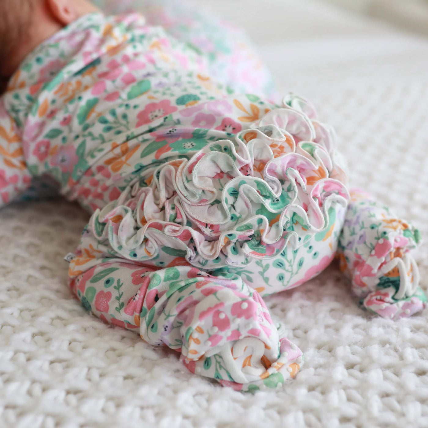 pastel floral ruffle butt baby footie 
