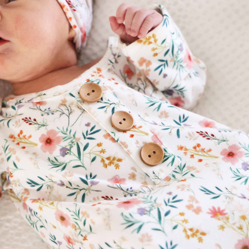 printed newborn knot gown in soft pastel florals for girls