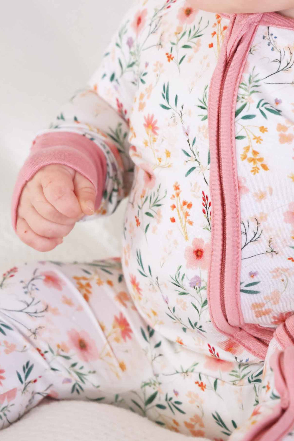 baby pink and watercolor wildflower print convertible zip sleep romper for girls